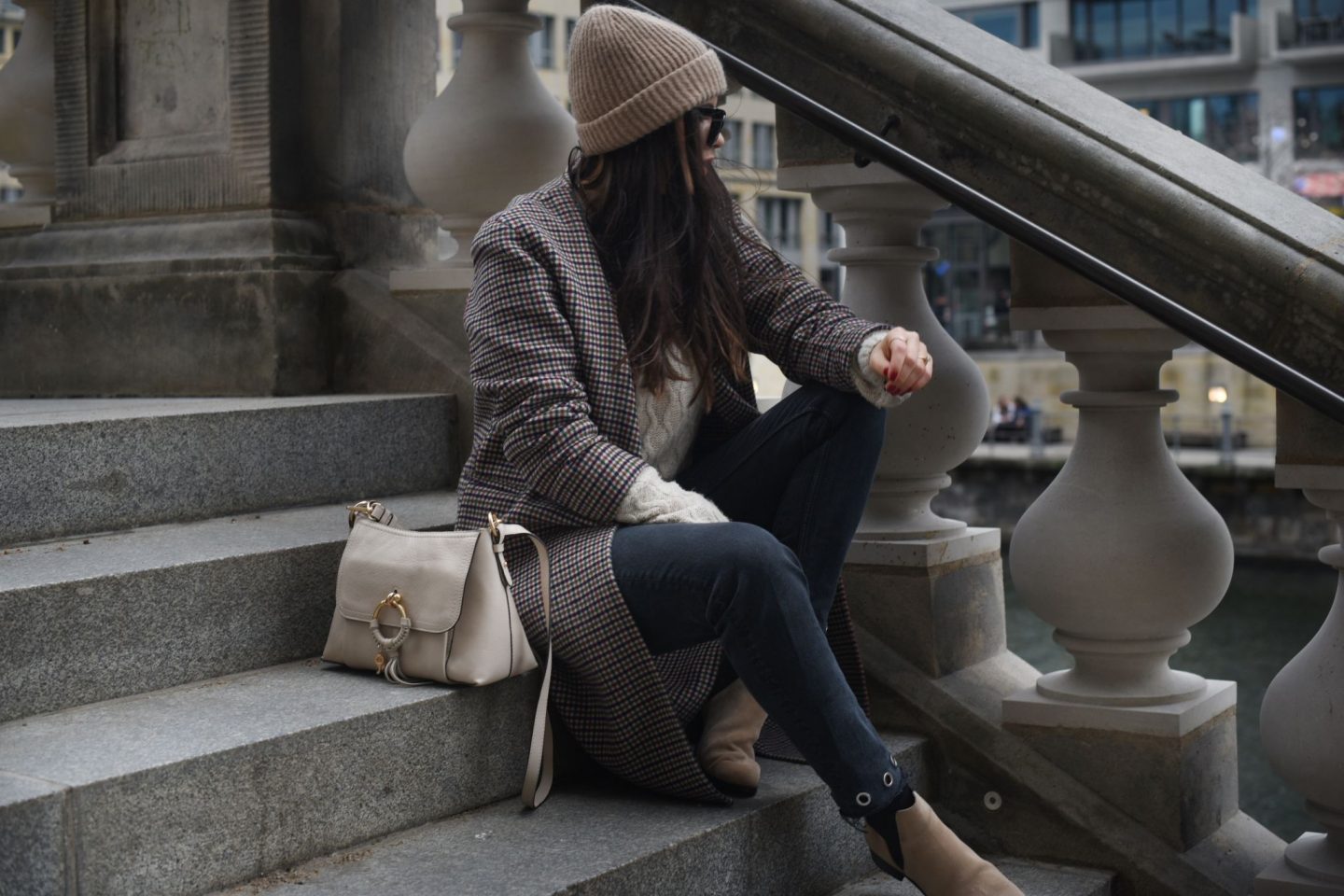 beige colored look with a checked coat