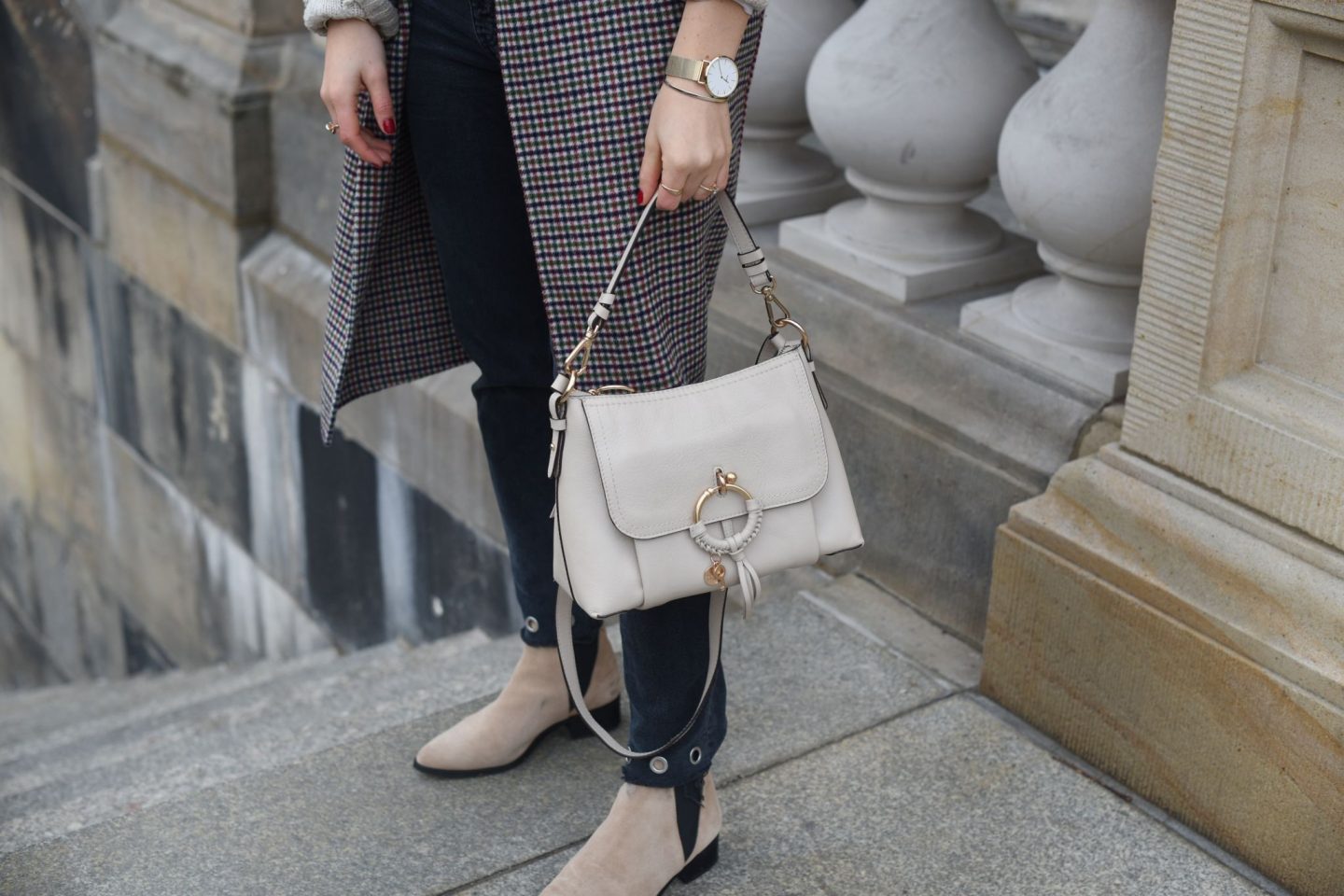 beige colored look with a checked coat